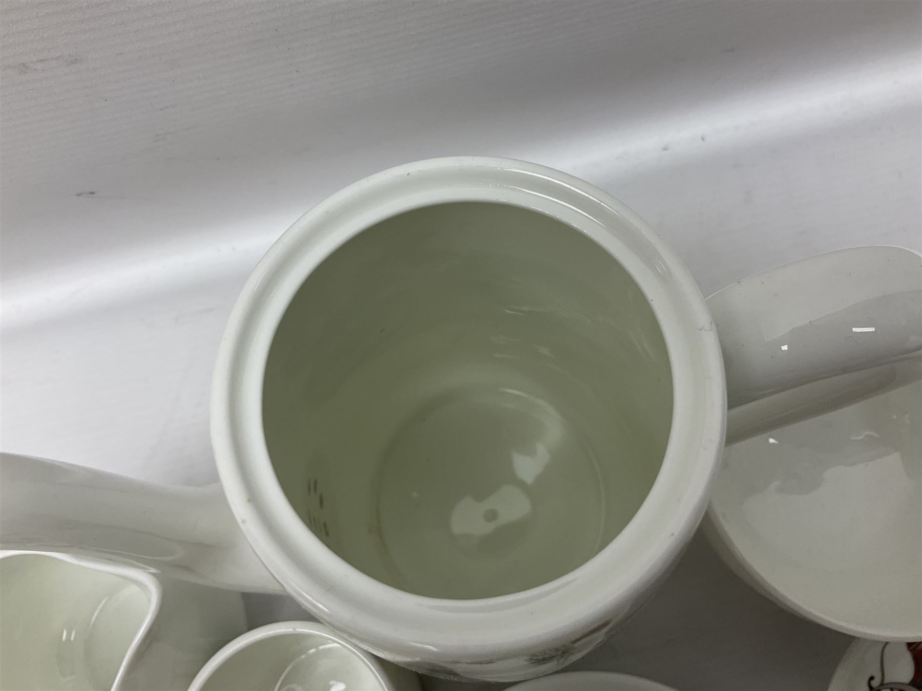 Crown Staffordshire coffee service for six, decorated with motor cars 