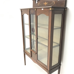 Edwardian inlaid mahogany display cabinet, raised shaped back, two doors flanking central leaded colour glass panel enclosing two shelves, square tapering supports, W112cm, H188cm, D39cm