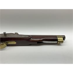 Early 19th century percussion cap cavalry pistol with round 23cm unsighted barrel, borderline engraved action lock (lacking hammer), walnut full stock with heavy brass furniture, iron lanyard ring to the flat butt cap and long flat retaining spring below fore-end for captive ramrod (missing) L41cm overall