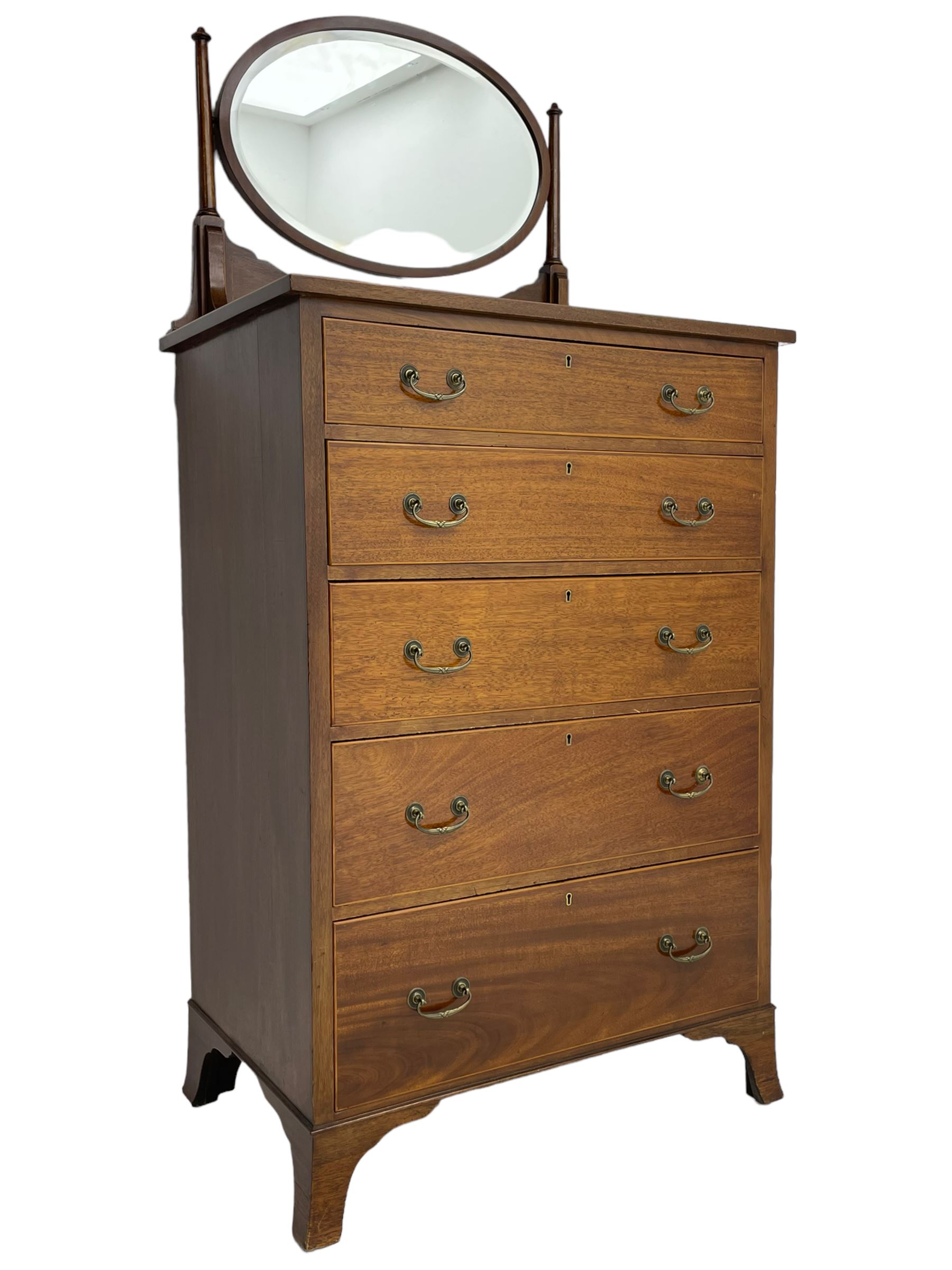 George III design mahogany straight-front chest, raised oval swing mirror with bevelled glass on turned supports, fitted with five graduating drawers with boxwood stringing, on bracket feet