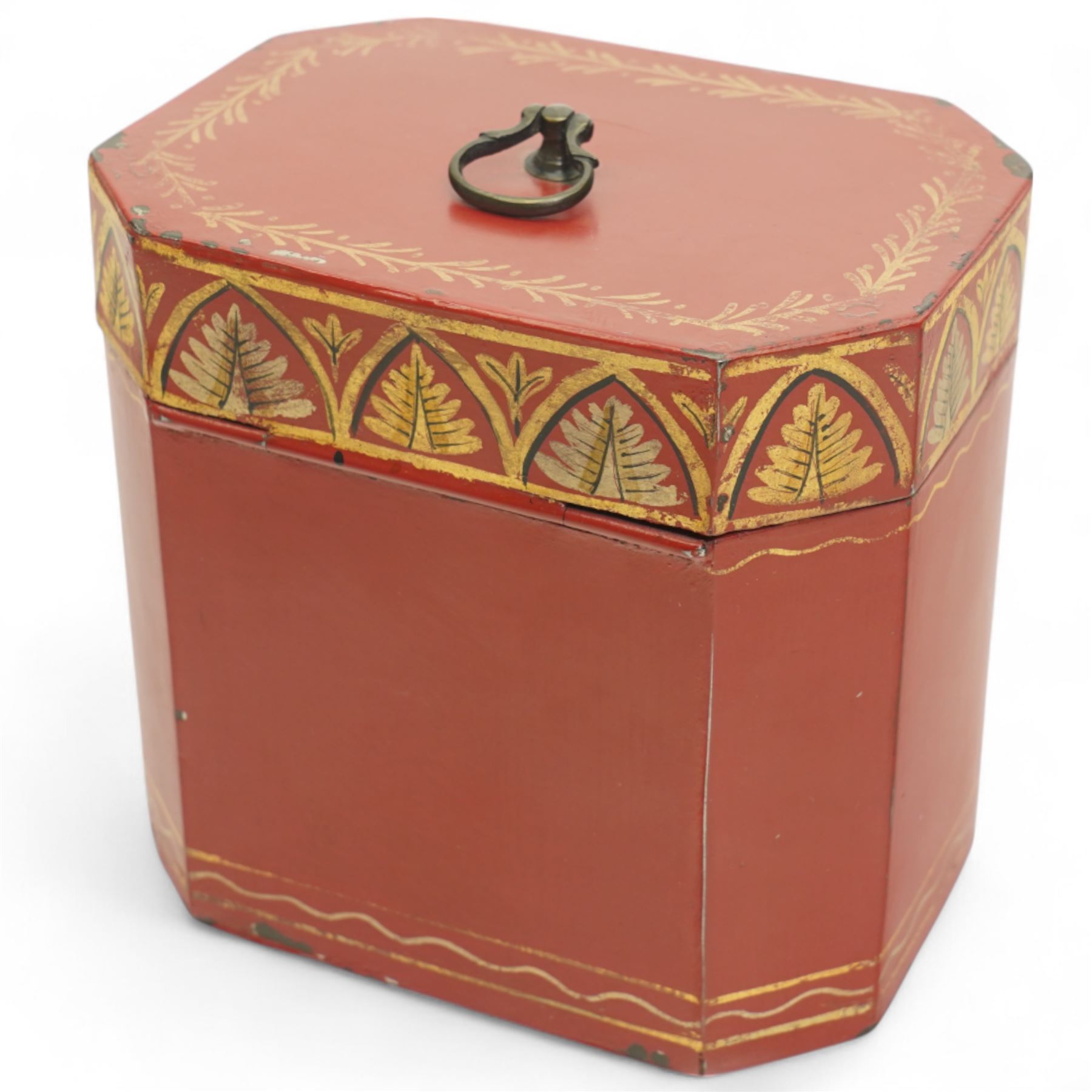 Regency period rare red toleware tea caddy of octagonal from, the cover decorated with a repeating pattern of gilt leaves, with key, H11cm 