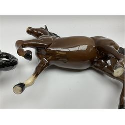 Beswick donkey and brown recumbent foal no. 915, Royal Doulton horse with raised left leg, and a further three brown horse figures (6)