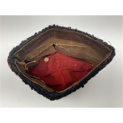 WW2 German small size Balkan style hat with 'SS' metal badges; red cloth top and flash to front with black persianelle type sides; lined in brown card with leather sweatband
