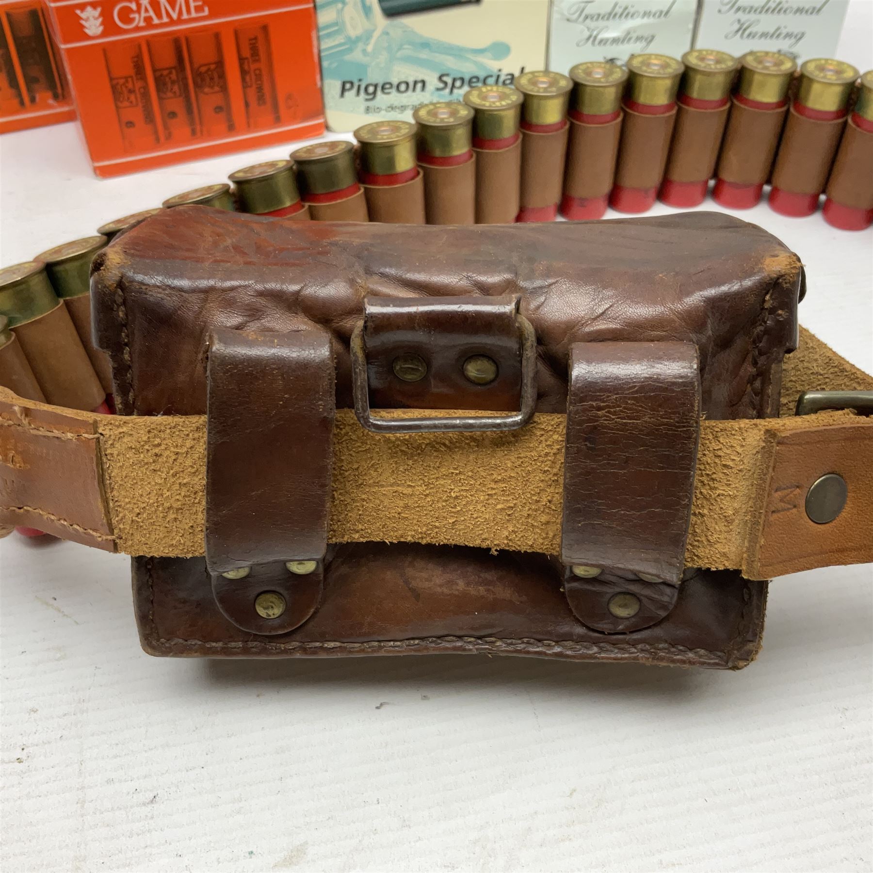 SHOTGUN CERTIFICATE REQUIRED - AMMUNITION - one-hundred and seventy-six 12-bore shotgun cartridges, boxed and in a leather cartridge belt with pouch; together with ninety-five .410 cartridges (seventy-nine 65mm and sixteen 50mm) in boxes