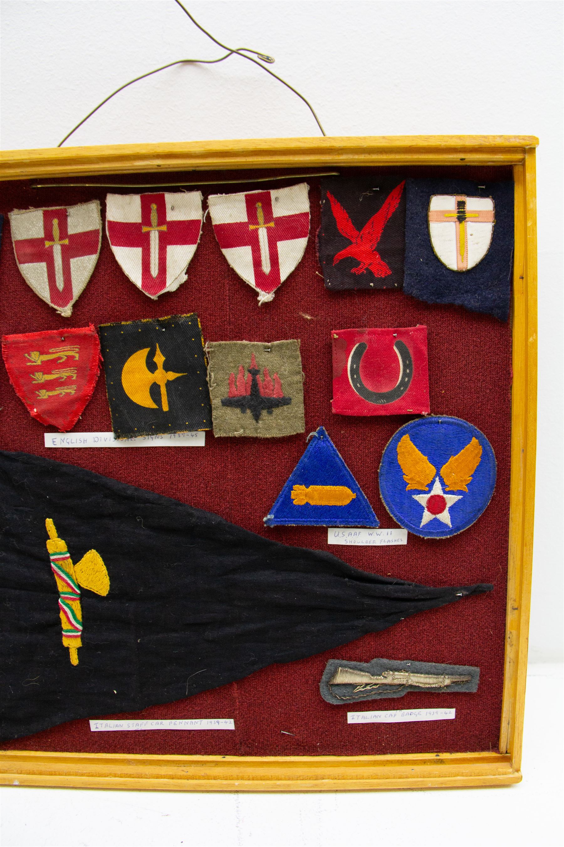 Fifteen WWII insignia cloth badges, including Channel Islands Liberation Force, 13th Infantry Division, British 78th infantry, 1st Army formation sign, USAAF WWII shoulder flashes, etc, all within a framed display H36cm,  W37cm   