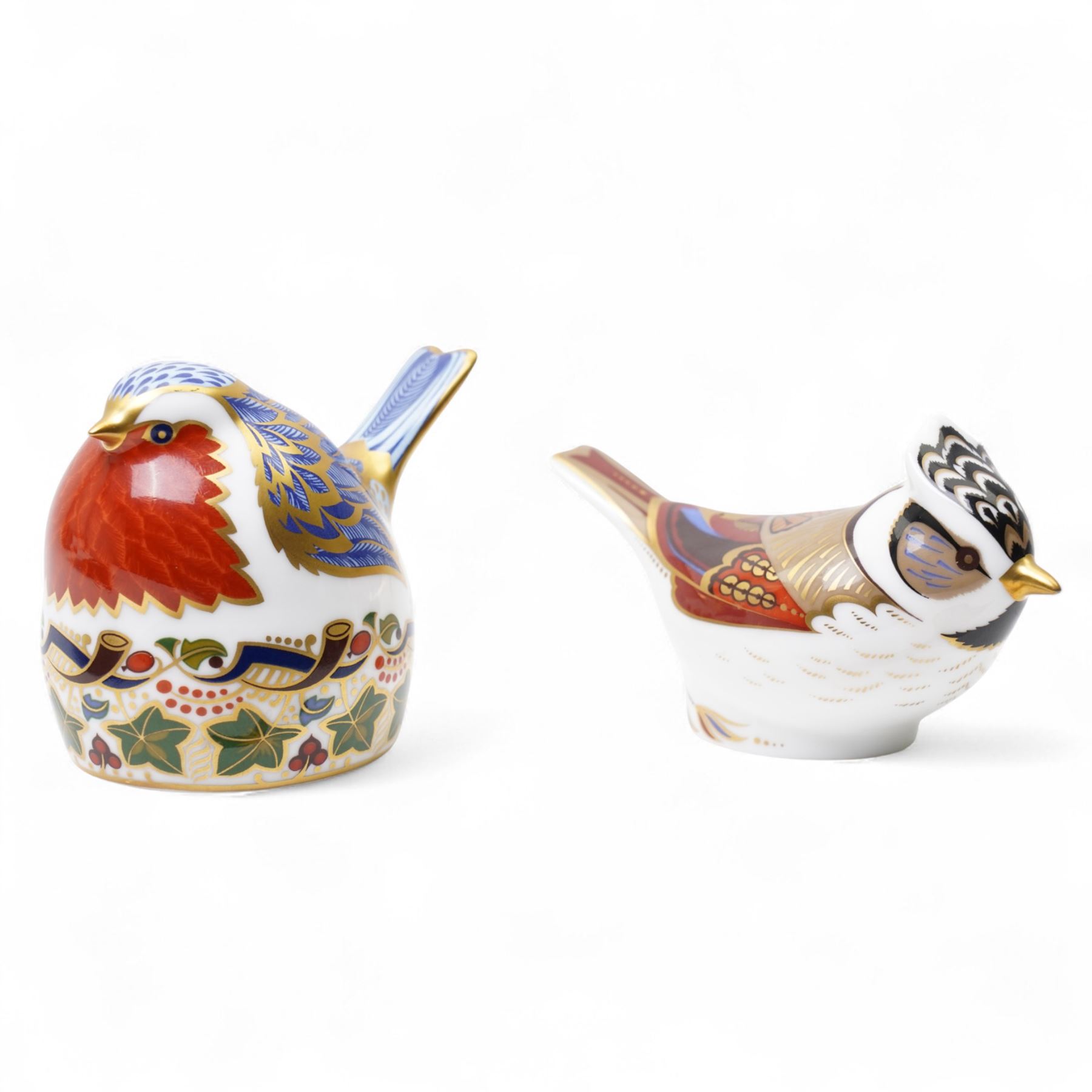 Four Royal Crown Derby paperweights, comprising crested Tit with original box and gold stopper, Robin with silver stopper, Blue Tit with gold stopper, and Jenny Wren (4)