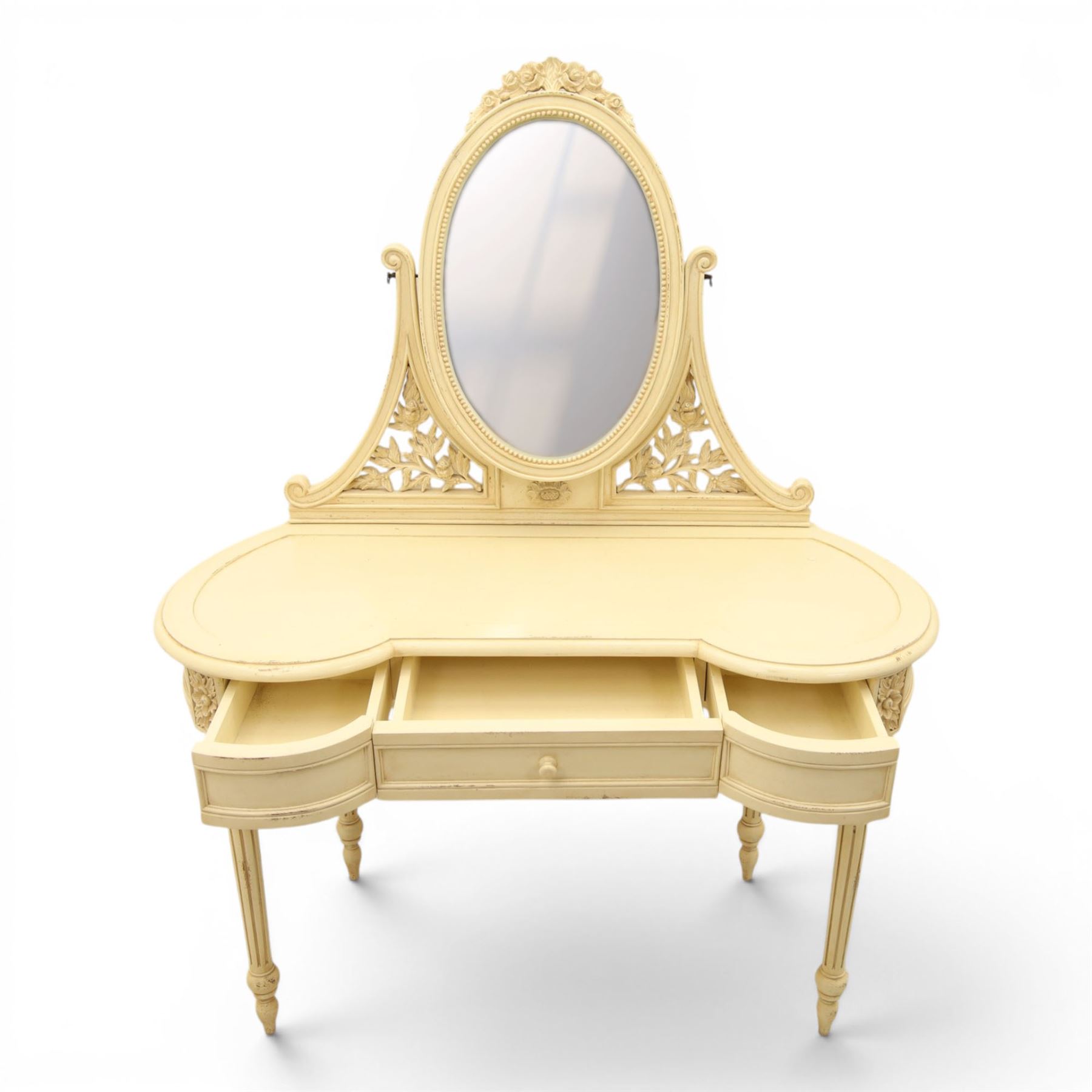 French Louis XV design cream painted dressing table and matching stool, kidney shaped top, with tilting oval mirror, carved uprights raised on fluted and turned supports 