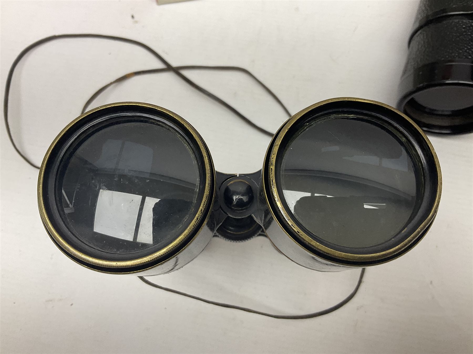 Pair of French binoculars by A.Tubeue Paris, together with three other pairs of binoculars including Telemax 5, Tasco Zip and Hanimax examples and a Panavue automatic slider viewer