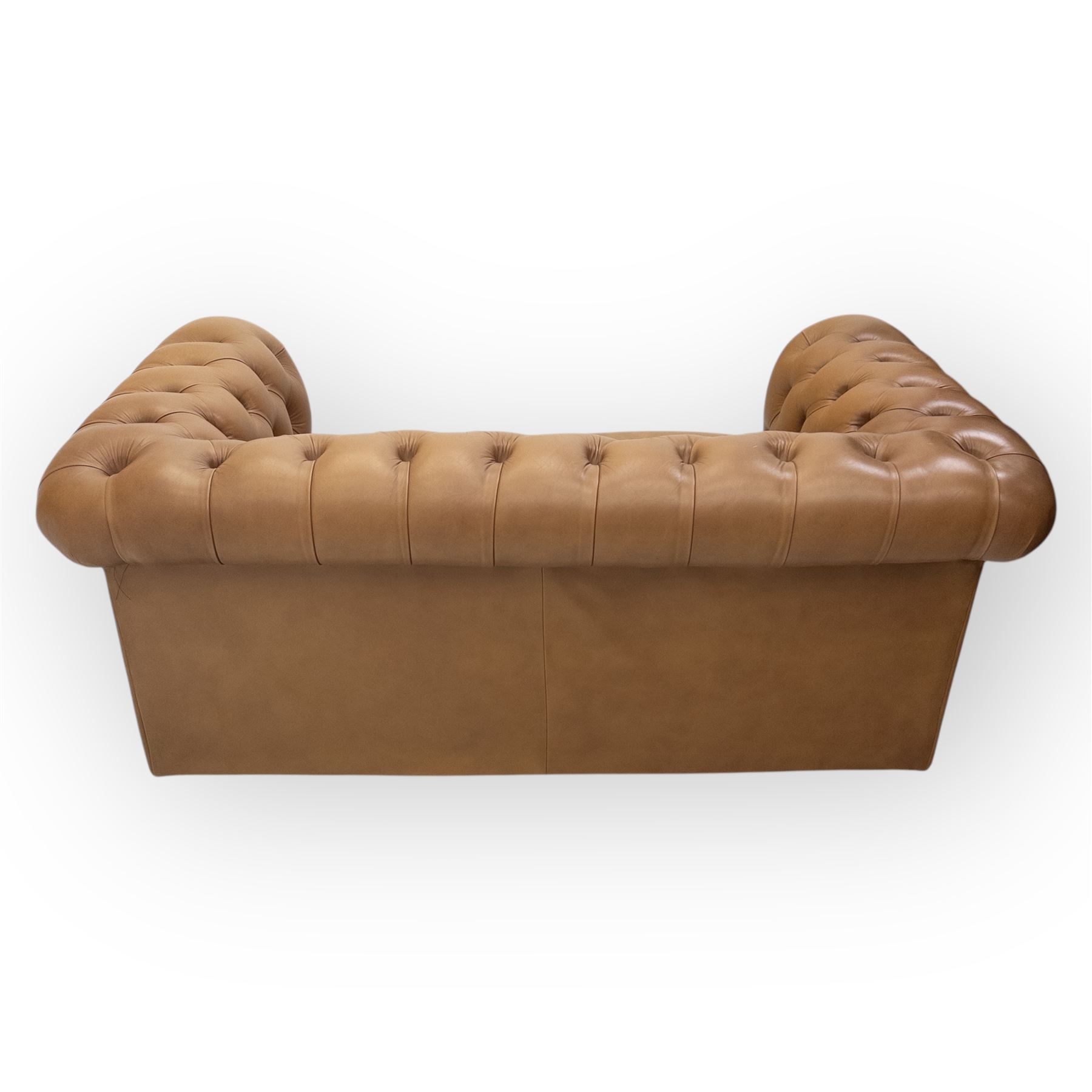 Contemporary tan leather chesterfield settee, deep button upholstered throughout with rolled arms and back of equal height, brass stud detailing, twin seat cushions