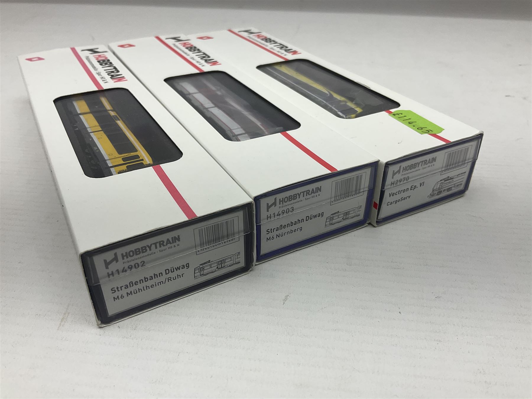 Hobbytrain 'N' gauge - three locomotives - H2970 Vectron Ep.VI CargoServ; H14902 Strassenbahn Duwag M6 Muhlheim/Ruhr; and H14903 Strassenbahn Duwag M6 Nurnberg; all boxed (3)