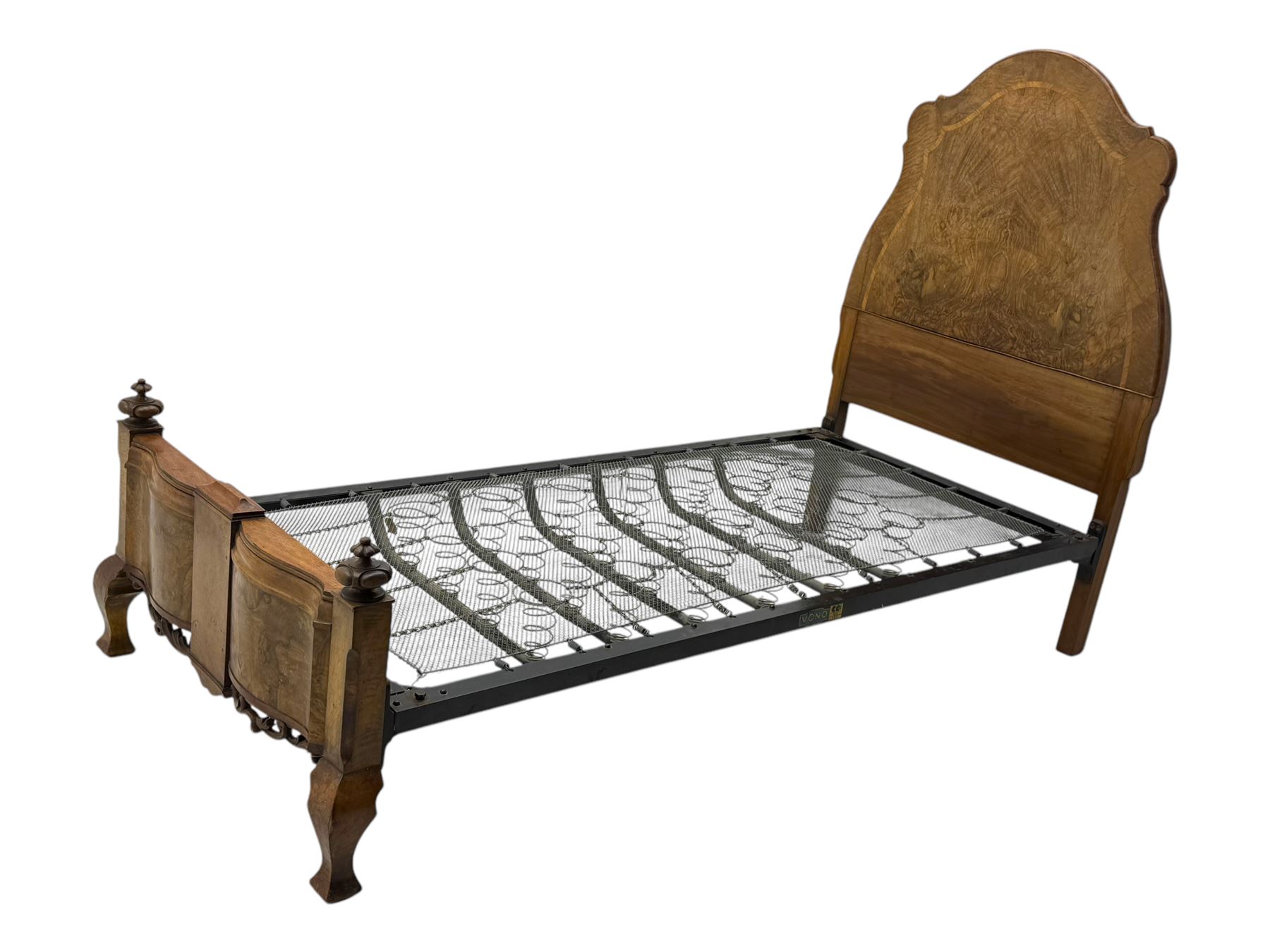 Mid-20th century walnut single bedstead, high shaped headboard, footboard with turned finials and scrollwork carvings, complete with 'Vono' iron frame, raised on cabriole supports