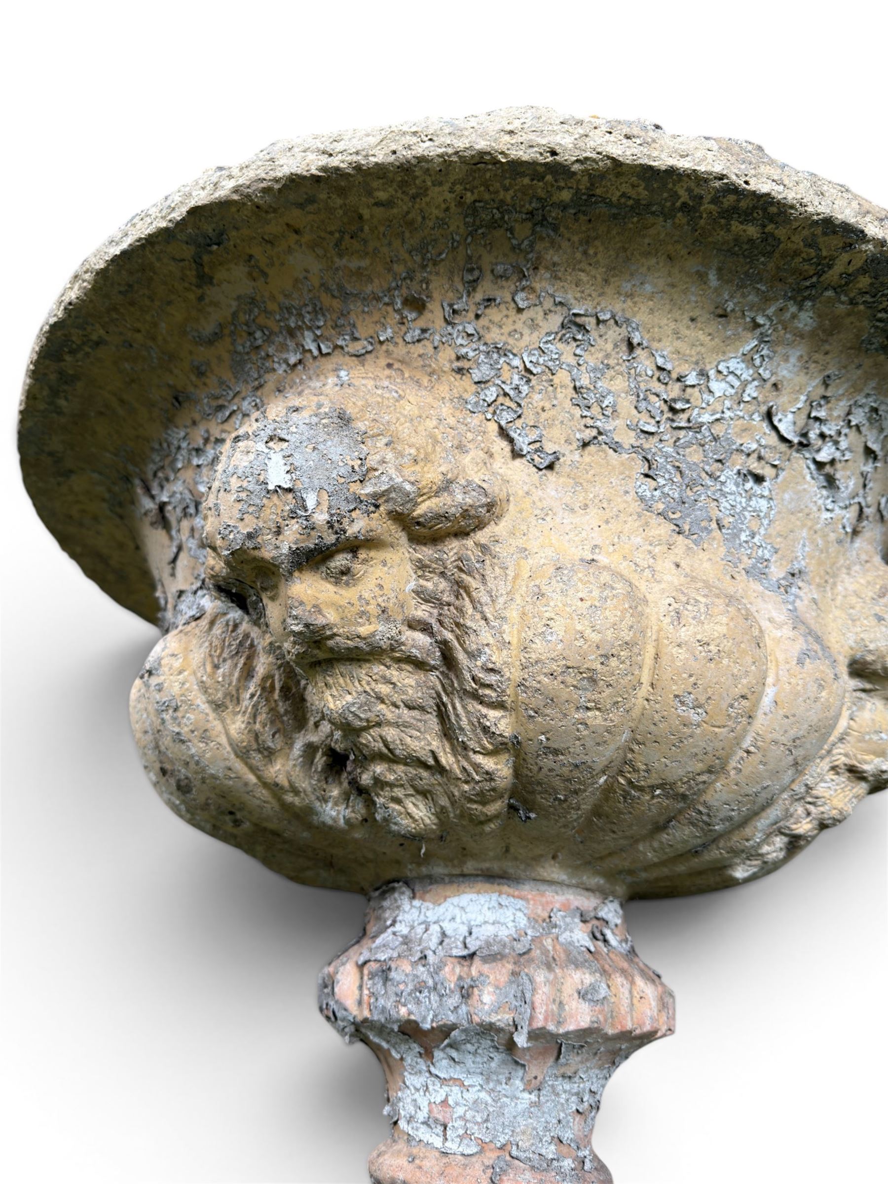 19th century terracotta campana shape urn planter, egg-and-dart moulded rim over a cherub-mask and gadrooned underbelly, turned pedestal and socle on square base