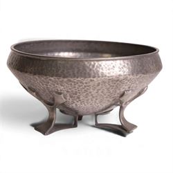 Oliver Baker for Liberty & Co - Tudric pewter bowl with hammered finish, upon three openwork feet, model number 01128 and makers marks stamped beneath, H10cm, D19cm
