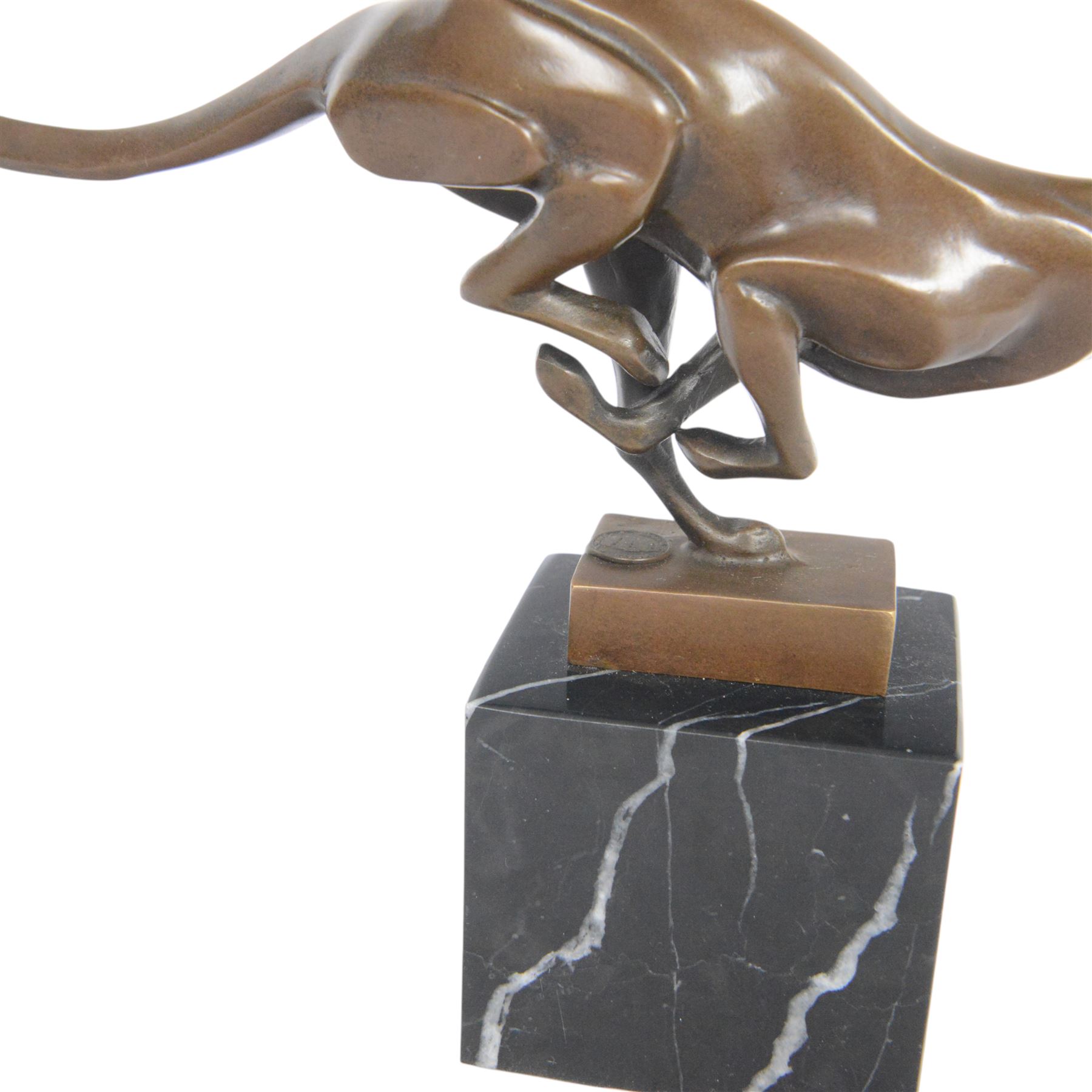 Bronze figure, modelled as a running cheetah, with foundry mark, raised upon a marble base, H20cm