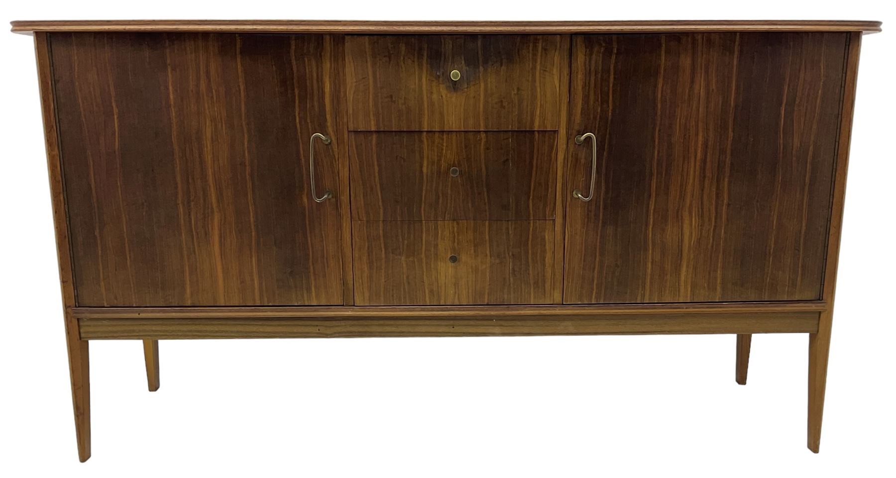 Peter Hayward for Vanson - mid-20th century teak sideboard, rectangular top with rounded corners over three central drawers, flanked by two cupboard doors enclosing shelves, raised on tapered supports
