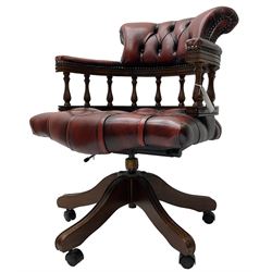 Swivel Captain's desk chair, upholstered in red studded leather