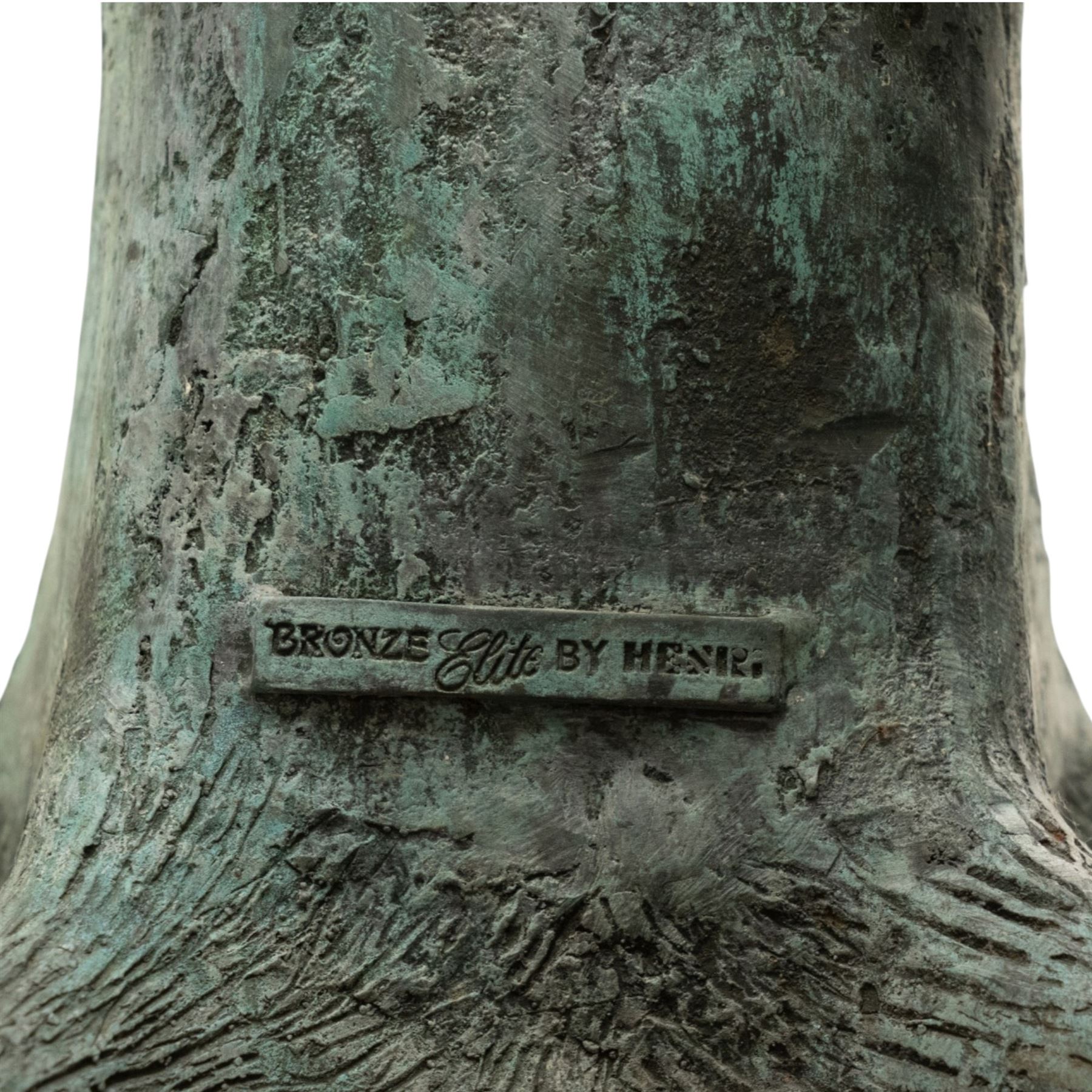 After Eneri Prosperi, bronze garden letterbox, modelled as a seated boy reading on a tree stump, with rustic post box with mail indicator, dog at his feet, textured verdigris finish throughout