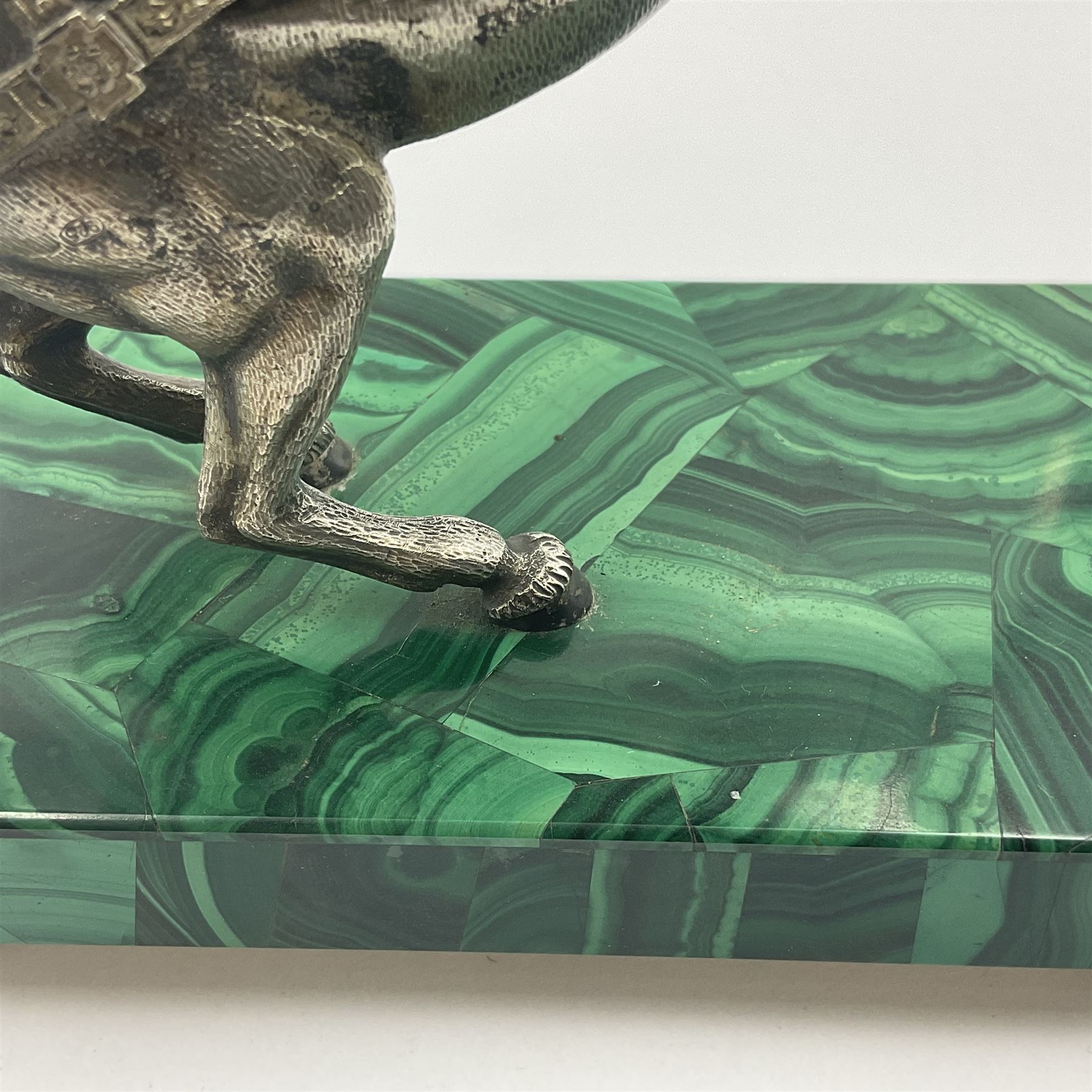 Modern silver model of a rearing horse, with ornate parcel gilt saddle and bridle, mounted upon a rectangular base, decorated with malachite panels to each side and upon four gilt bun feet, horse stamped 925, overall H14.5cm