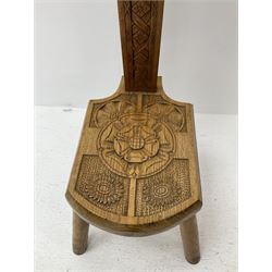 Heavily carved oak milking stool, turned supports 