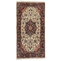 Persian ivory ground rug, the central pole medallion surrounded by intertwining foliate decoration and palmettes, guarded border with Boteh motifs and stylised flower heads
