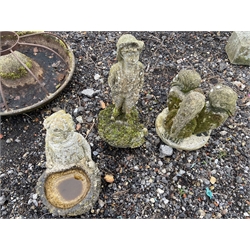 Three composite stone garden figures