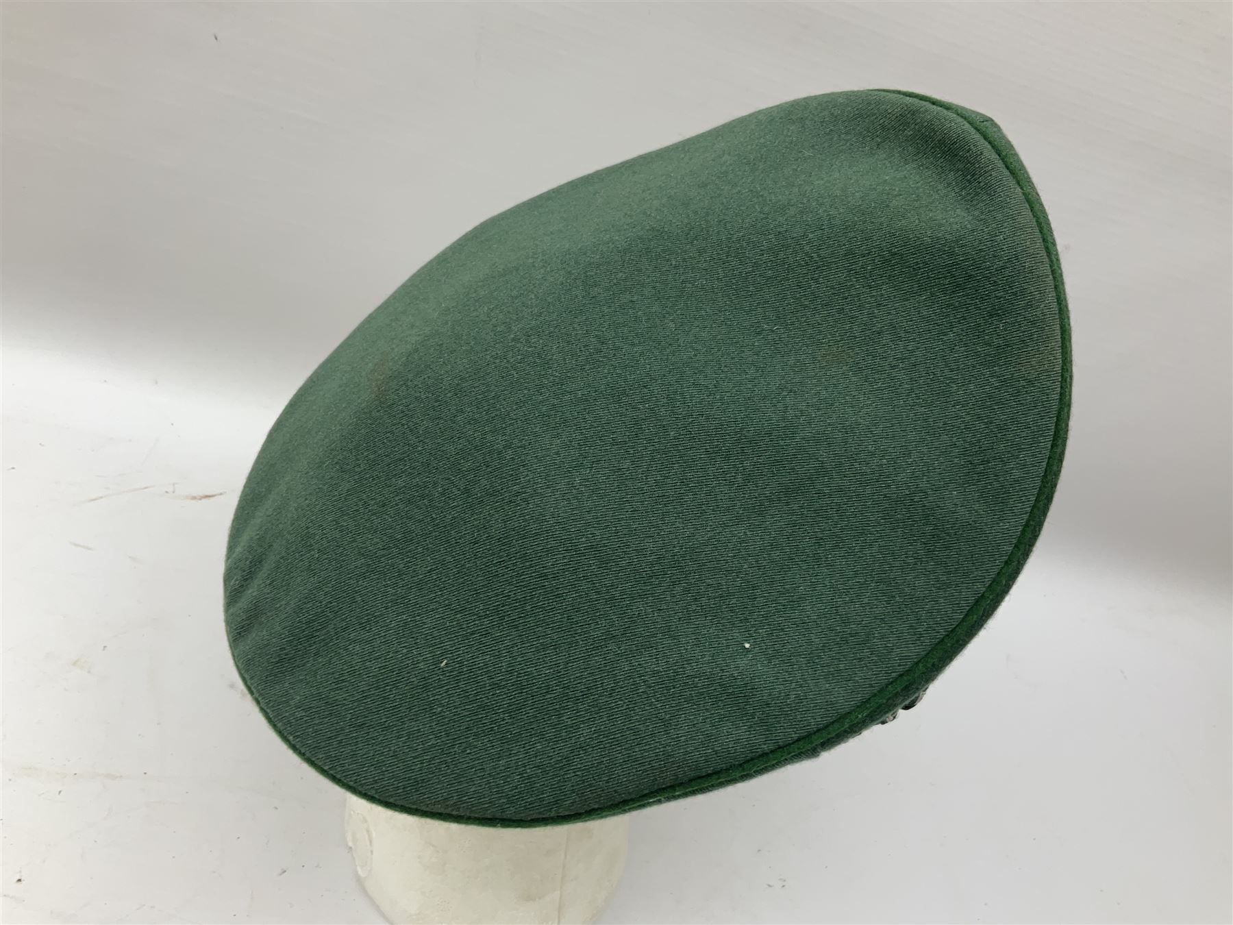 Five reproduction German WW2 hats comprising Wehrmacht olive tropical helmet, Heer officer's peaked cap, two M43 caps and Field side cap (5)