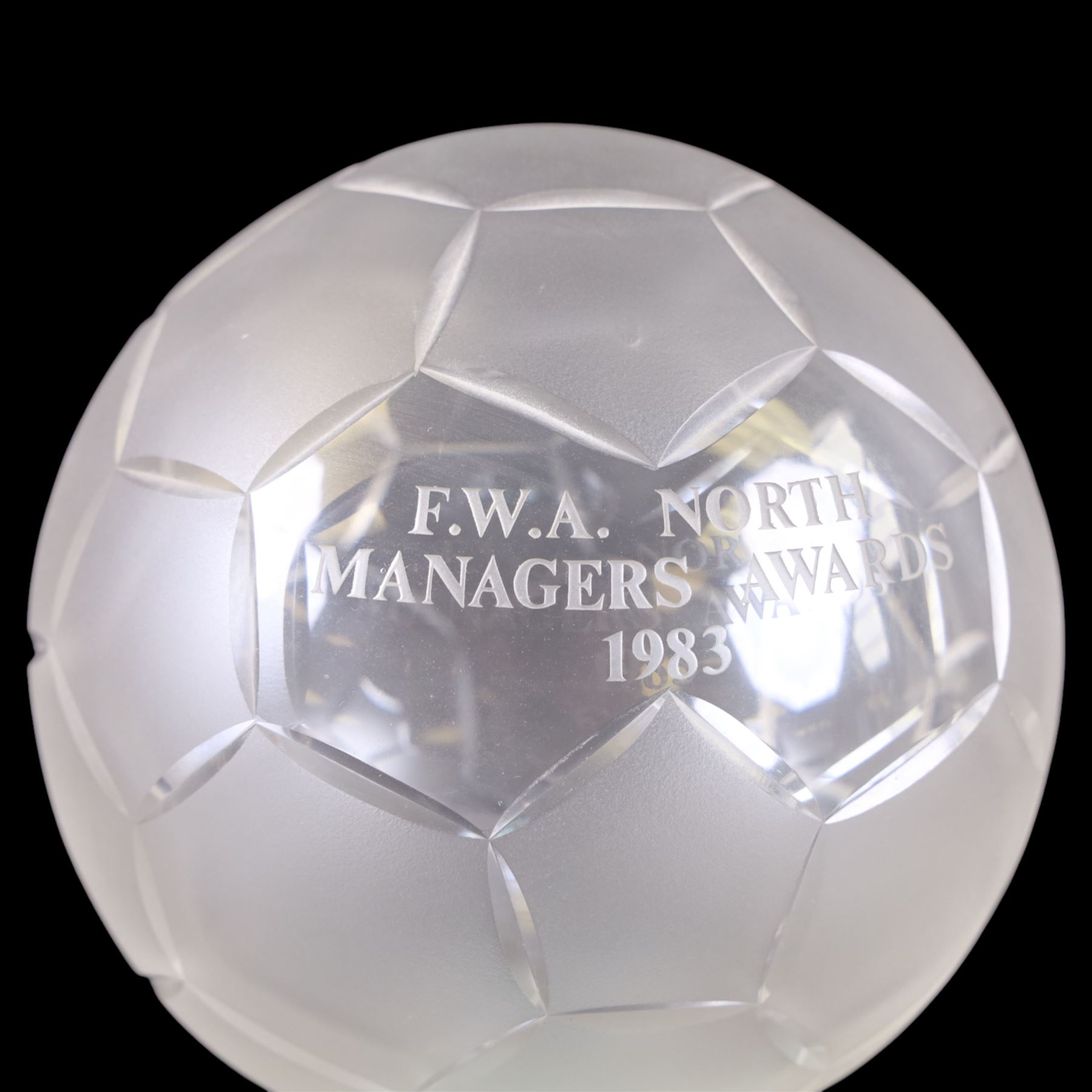 Royal Doulton crystal football trophy, modelled as a football with frosted panels, presentation engraving reading FWA North Managers Awards 1983, upon a wooden socle plinth, height including plinth H26cm