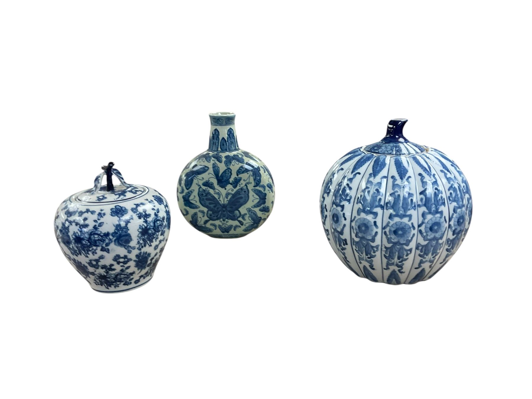 Chinese blue and white porcelain jar in the form of a pumpkin together with moon flask decorated with butterfly's and one other, largest H30cm 