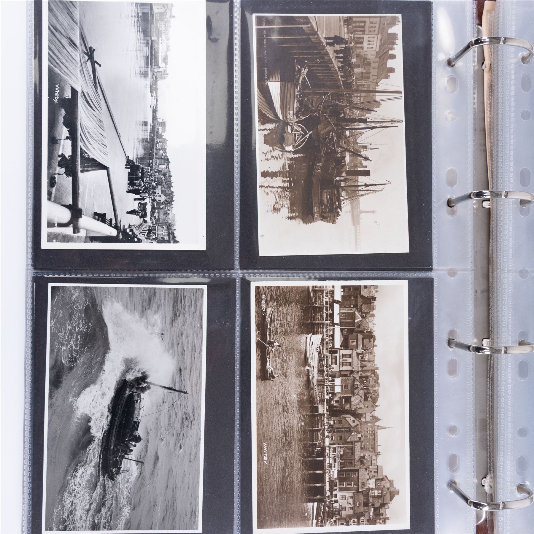 One-hundred and seventy two early 20th century Whitby view postcards, including a detailed collection documenting the destruction of Whitby following the bombardment by the German Fleet in 1914, a selection depicting the construction of the pier extensions, the opening of the new river drawbridge, a re-enactment of the medieval tradition of building the 'Penny Hedge' and the 1932 flooding of the town centre, together with a selection depicting social events at Spa, all housed within a Stanley Gibbons Picture Postcard Album