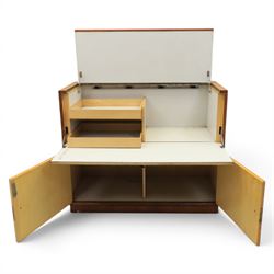 Teak mid 20th century fall front cabinet, hinged top with geometric inlay front, above twin cabinet doors