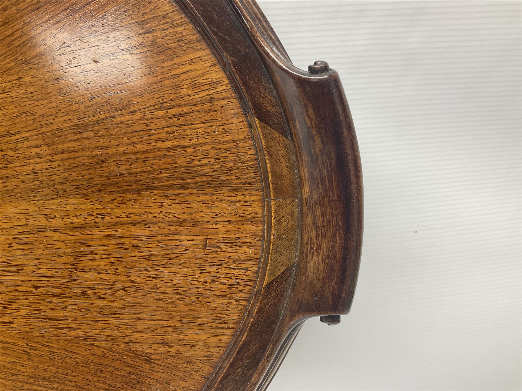 Late 19th/early 20th century mahogany and marquetry inlaid tray, of oval form with twin scrolled handles and moulded border, the central panel inlaid with figures seated at a table drinking tea, L99cm