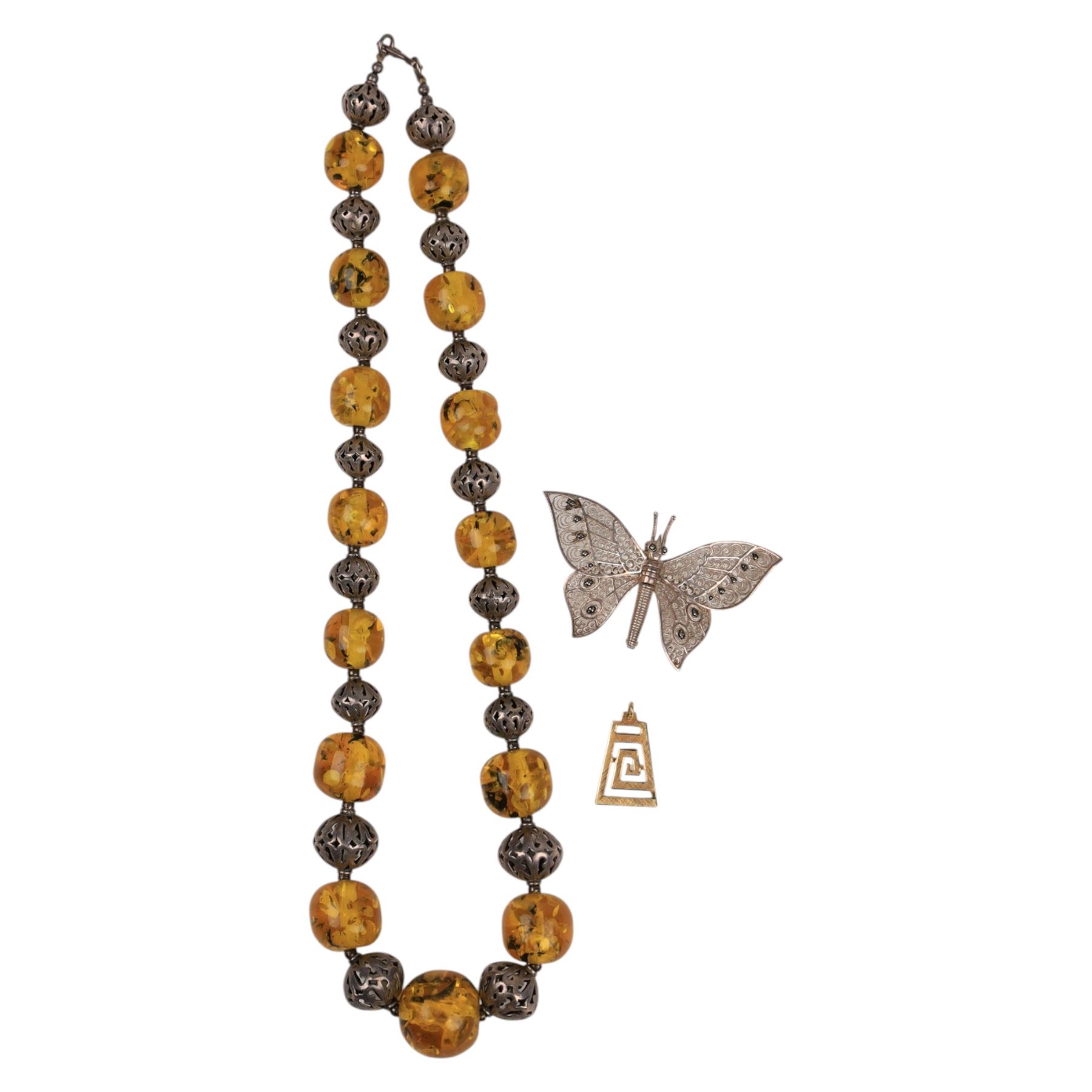 18ct gold spiral pendant, silver butterfly brooch and a beaded necklace