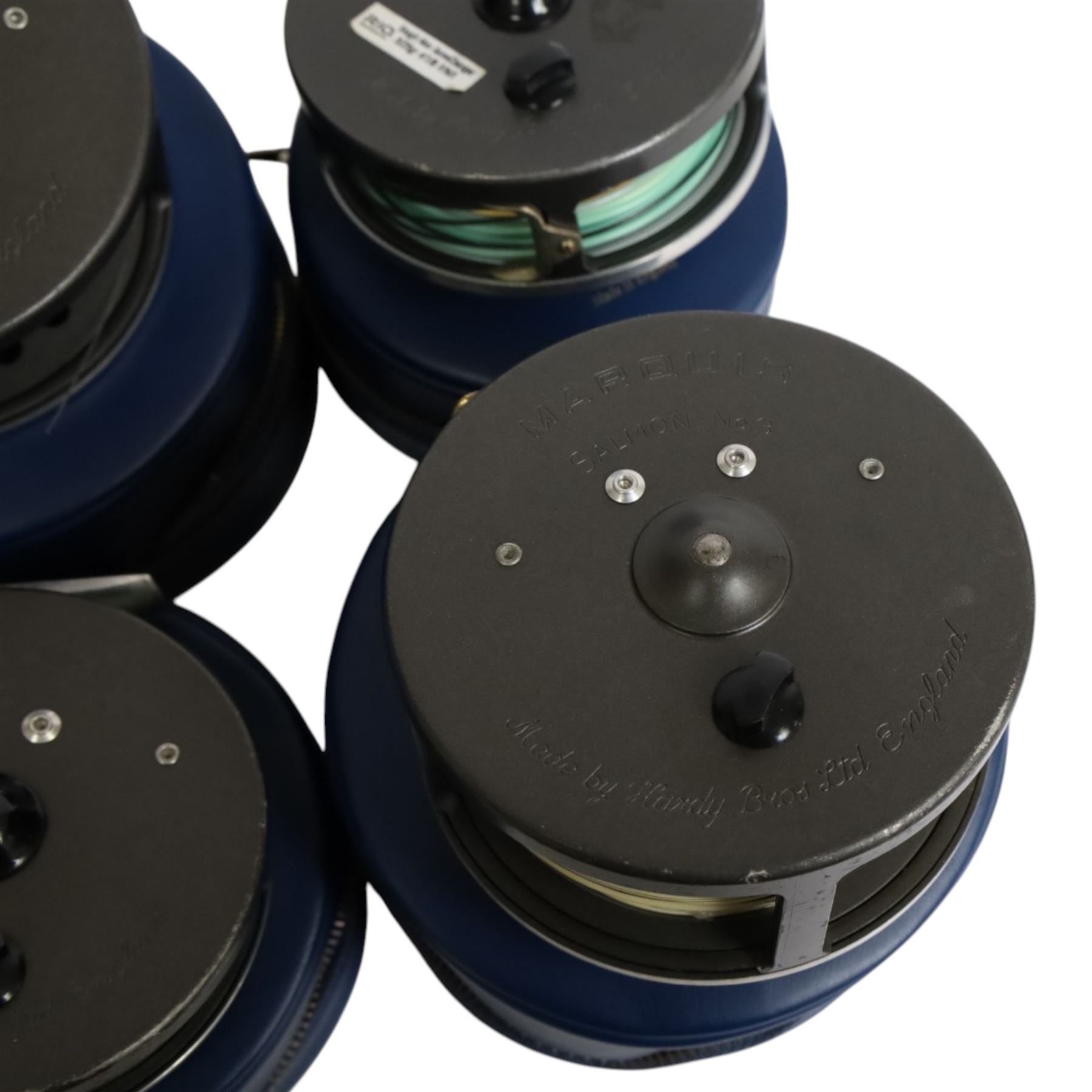 Four Hardy Bros Marquis fly fishing reels, comprising two No. 3 salmon reels, No.1 Salmon reel and a No. 10 reel, all within blue Hardy cases