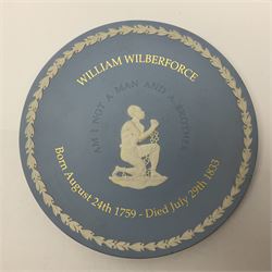 Group of William Wilberforce Abolition of Slavery items, comprising Wedgwood black on cane Jasperware pin tray, Wedgwood light blue Jasperware plate, and two Wedgwood oval medallion pendants, each depicting a kneeling figure beneath the inscription 'AM I NOT A MAN AND A BROTHER?', an Eastgate pottery plaque decorated in relief with a kneeling figure before William Wilberforce, a Hull Museum Publications pamphlet titled 'Medals, Tokens, etc., Issued in Connection with William Wilberforce and the Abolition of Slavery', by Thomas Sheppard, dated 1916, and an antique print depicting William Wilberforce after the original portrait by George Richmond, (7)