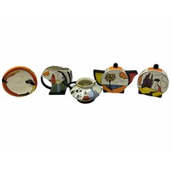 Lorna Bailey Old Ellgreave Pottery, comprising teapot in beach design, circular jar in house and path design, shell jug in Bridge and stream design, squat jug in Pagoda design and plate decorated with an Art Deco woman, all with printed and painted marks. 