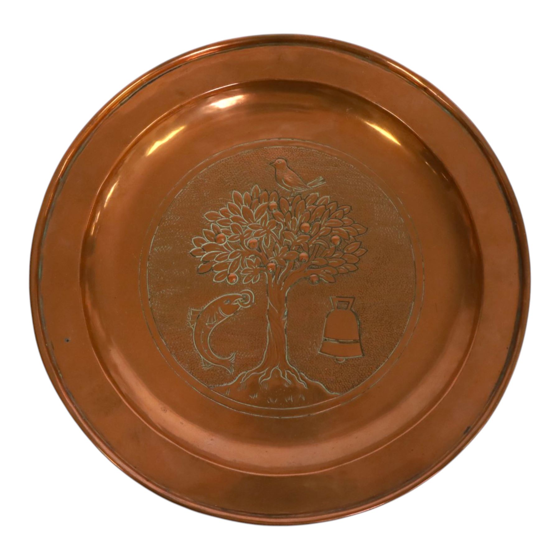 The Keswick School of Industrial Art, St Kentigern charger, the central panel which features four key symbols representing miracles from his life ', which features four key symbols representing miracles from his life: bird, tree, bell, and fish with a ring, 'The bird that never flew, the tree that never grew, the bell that never rang, the fish that never swam', marked beneath B352 KSIA Keswick, D24cm