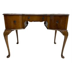 Early 20th century Queen Anne design walnut writing desk, reverse bow-front with inset green leather writing surface and foliate carved edge, fitted with three drawers, raised on cabriole supports