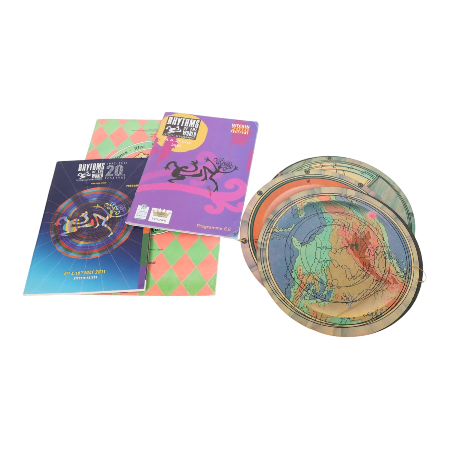 Music memorabilia, including cardboard globe, a free gift with the Wings Over America vinyl, music programmes, including Concert for George, Paul McCartney World Tour, Wings programmes, Glastonbury 1986, 10CC programmes, Knebworth Fair 1976 programme, etc