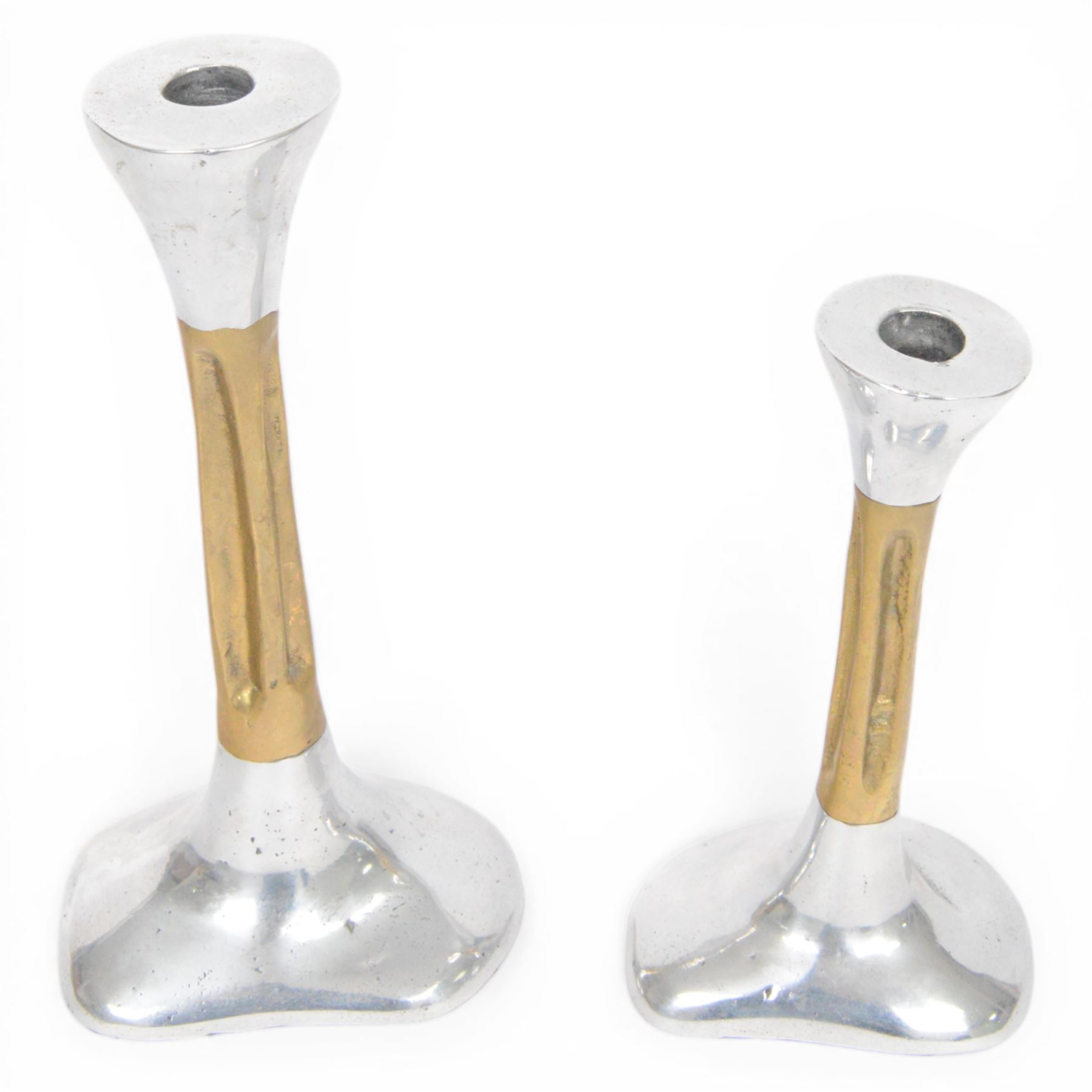 Set of David Marshall graduating candlesticks, brass and polished aluminium, makers mark impressed to stem, largest H26cm