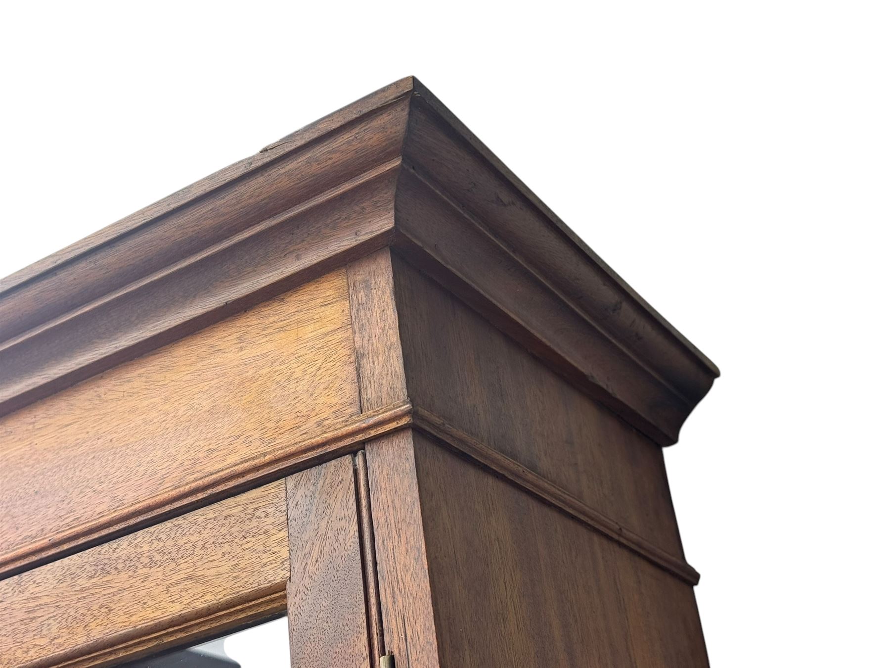 Late 19th century mahogany bookcase on chest, projecting moulded cornice over twin astragal glazed doors enclosing three shelves, base fitted with three graduated drawers, raised on shaped bracket supports