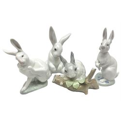 Four Lladro rabbit figures, comprising, Hippity Hop no 5886, Sitting Bunny no 5907, Washing up no 5887, and Rabbit Eating no 4773, largest example 14cm  