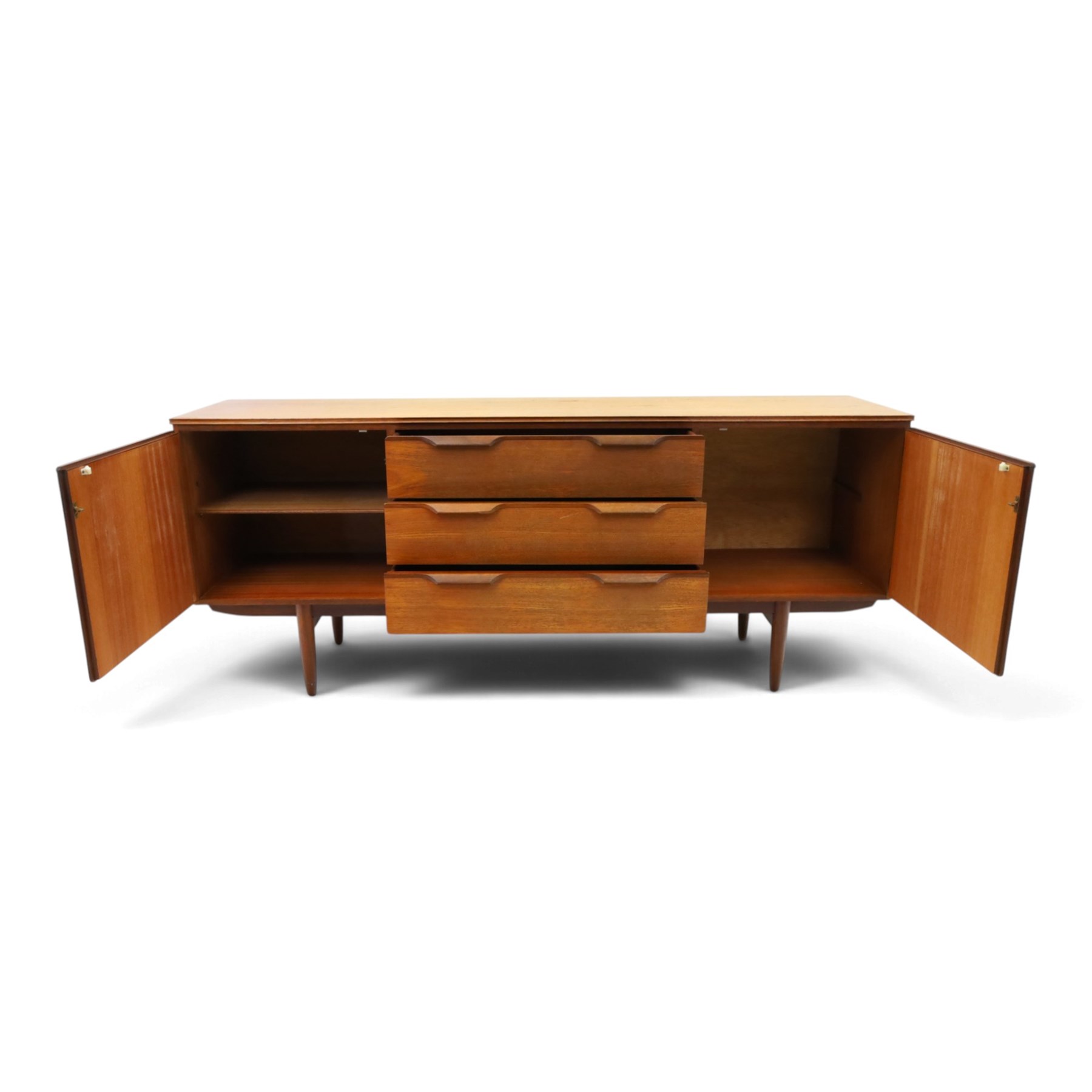 Frank Guille for Austinsuite - mid-20th century teak sideboard, fitted with three central graduating drawers flanked by cupboards, on tapering supports