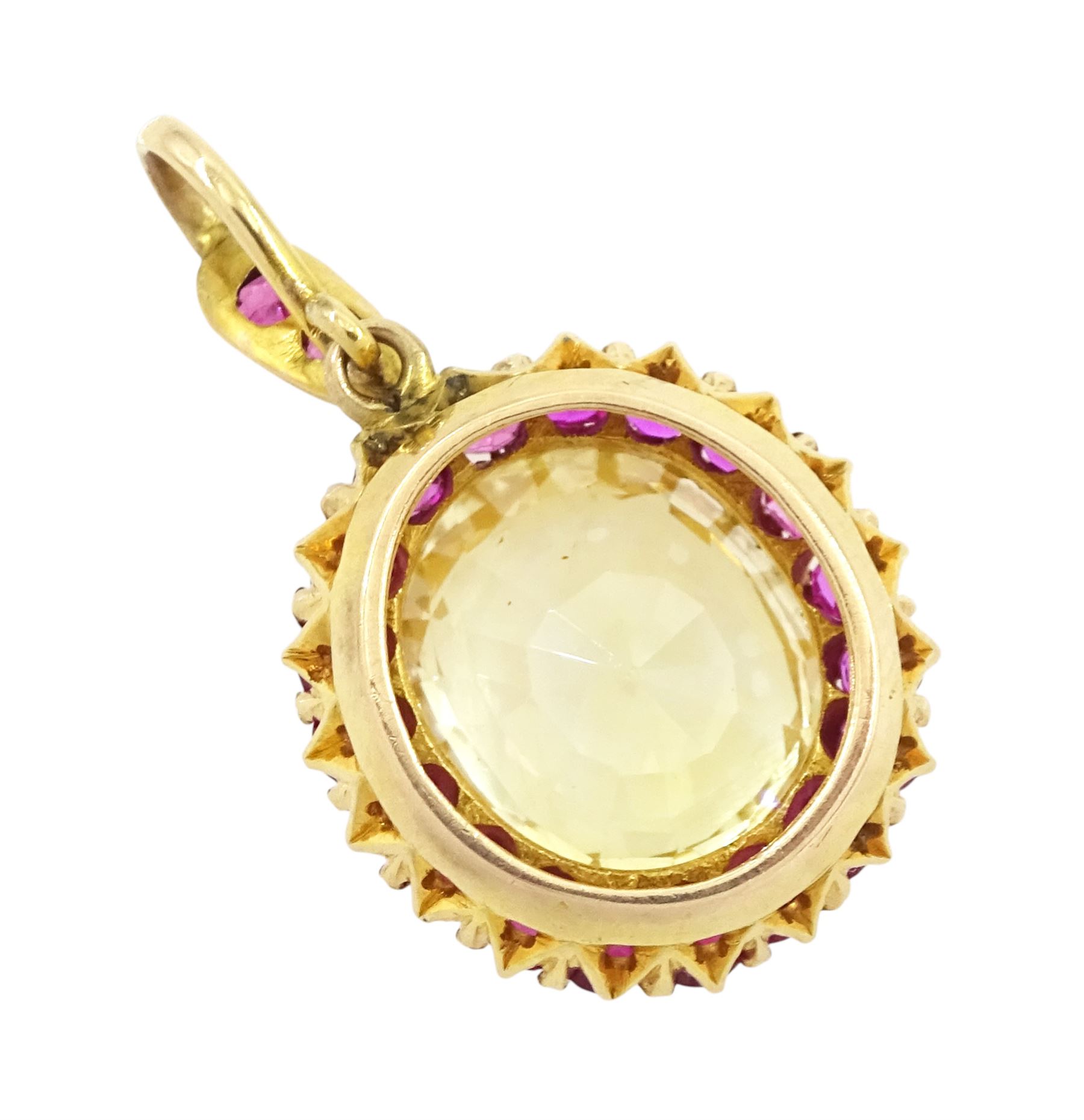 Gold yellow sapphire and ruby pendant, single cushion cut sapphire of approx 10.20 carat, surrounded by nineteen round cut rubies and ruby set bail
