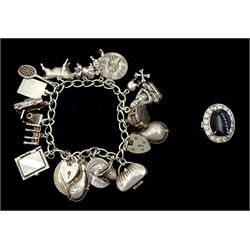  Silver charm bracelet, charms including handbag, bridge, scull and cross, tennis racket and Buddha and a white gold and silver onyx and paste stone cluster ring
