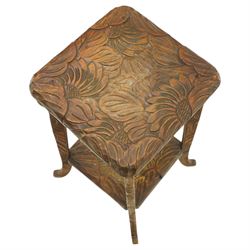 Attrib. Liberty & Co. - Arts & Crafts carved Japanese pattern two-tier occasional table, the square top with rounded corners heavily carved foliate motifs, raised on tapering supports with scroll feet united by undertier
