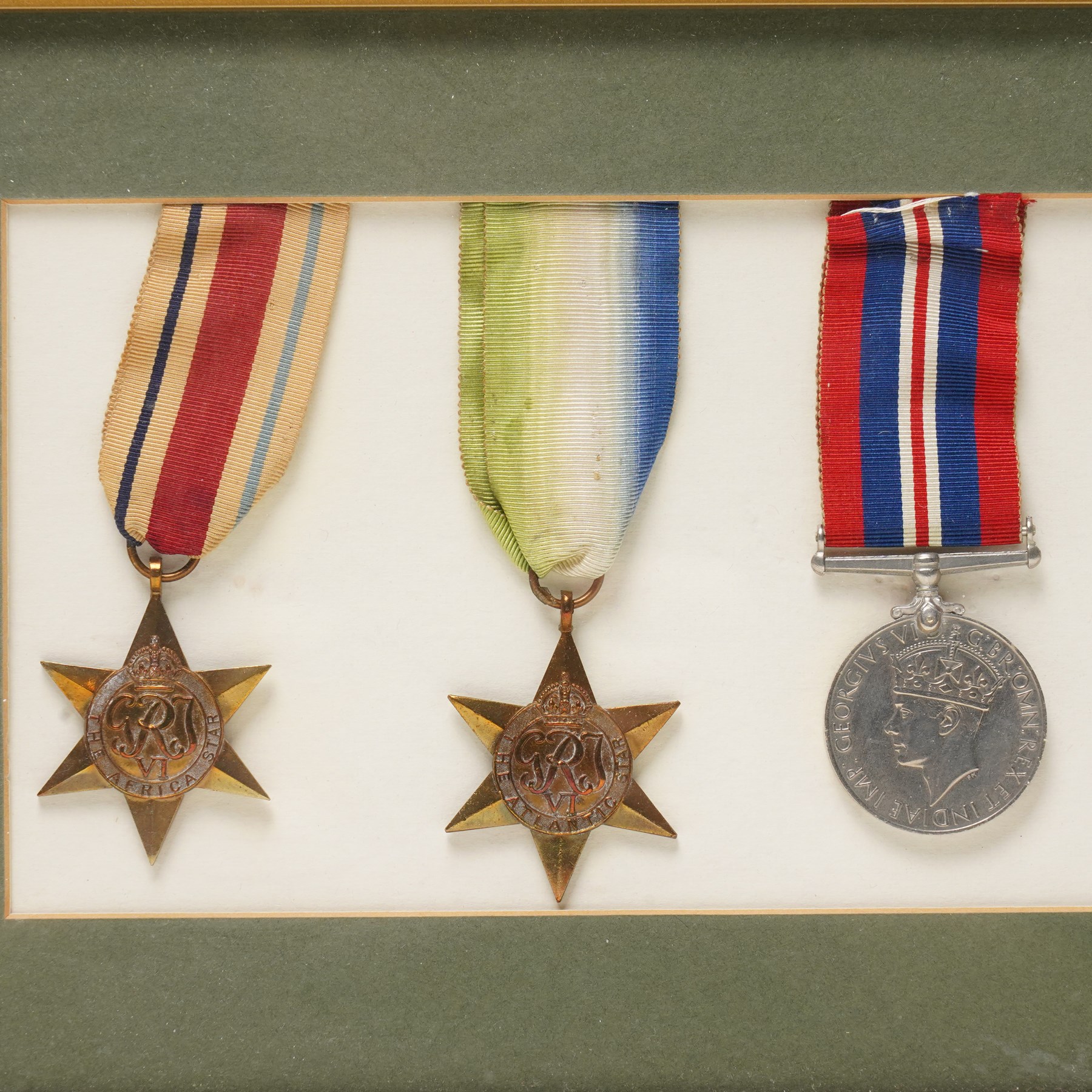 Group of six WWII medals comprising War Medal, 1939-1945 Star, Pacific Star with Burma clasp, Italy Star, Atlantic Star and Africa Star, framed