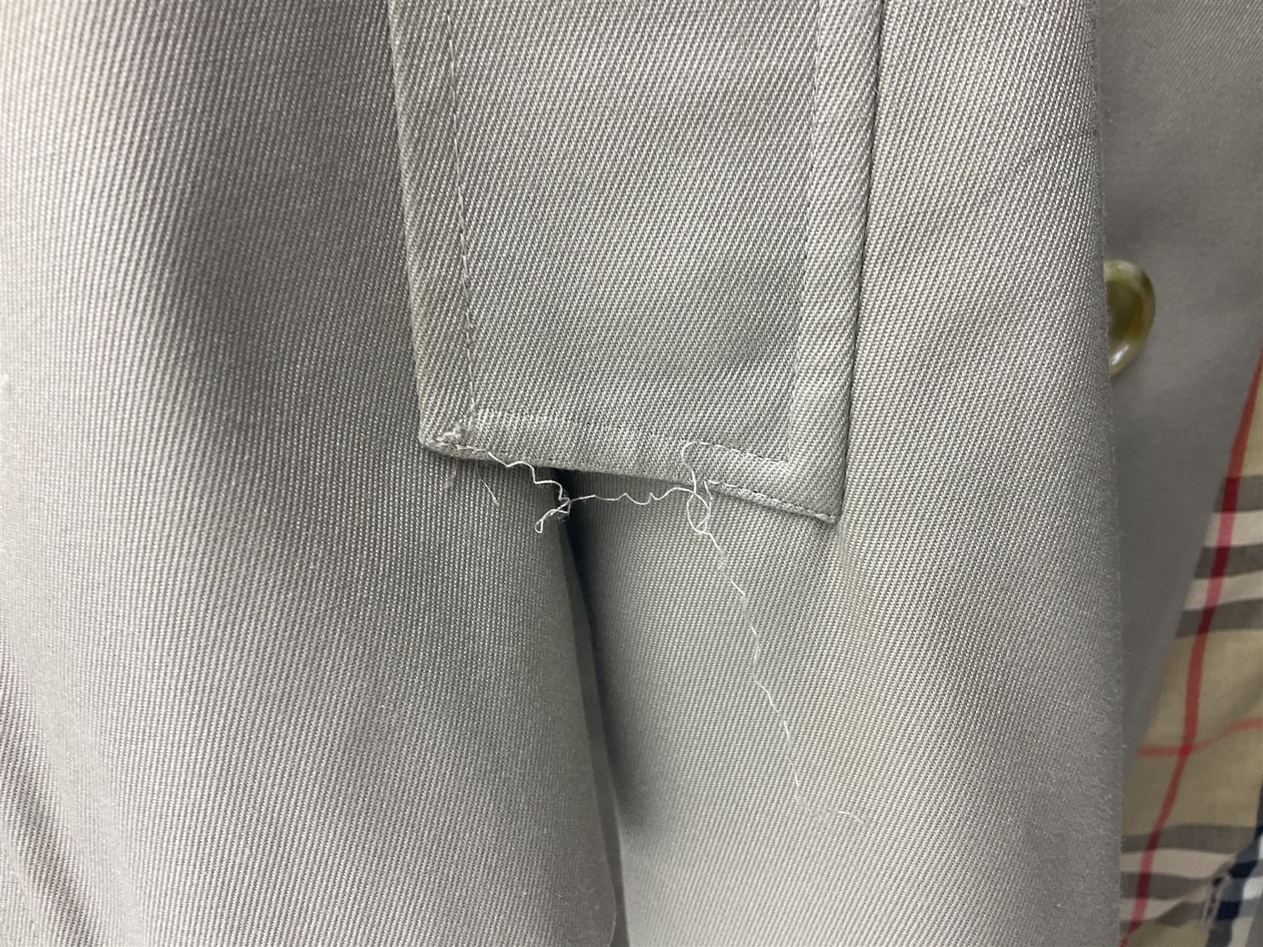 Ladies Burberry double breasted trench coat, with belt and detachable woollen gilet, in traditional cream colour with Burberry check lining, together with a gentlemans Burberry single breasted trench coat, both L112cm