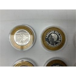 Eight Las Vegas limited edition ten dollar casino silver strike gaming tokens, consisting of a fine silver centre with brass outer ring (8)
