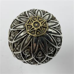 Modern silver limited edition Easter egg, no. 70/500, the openwork lattice body decorated with gilded panels of flower heads, opening to reveal a gilt interior, upon silver stand with three scrolling pad feet, each hallmarked St James House Company, London 1979, height including stand 8cm