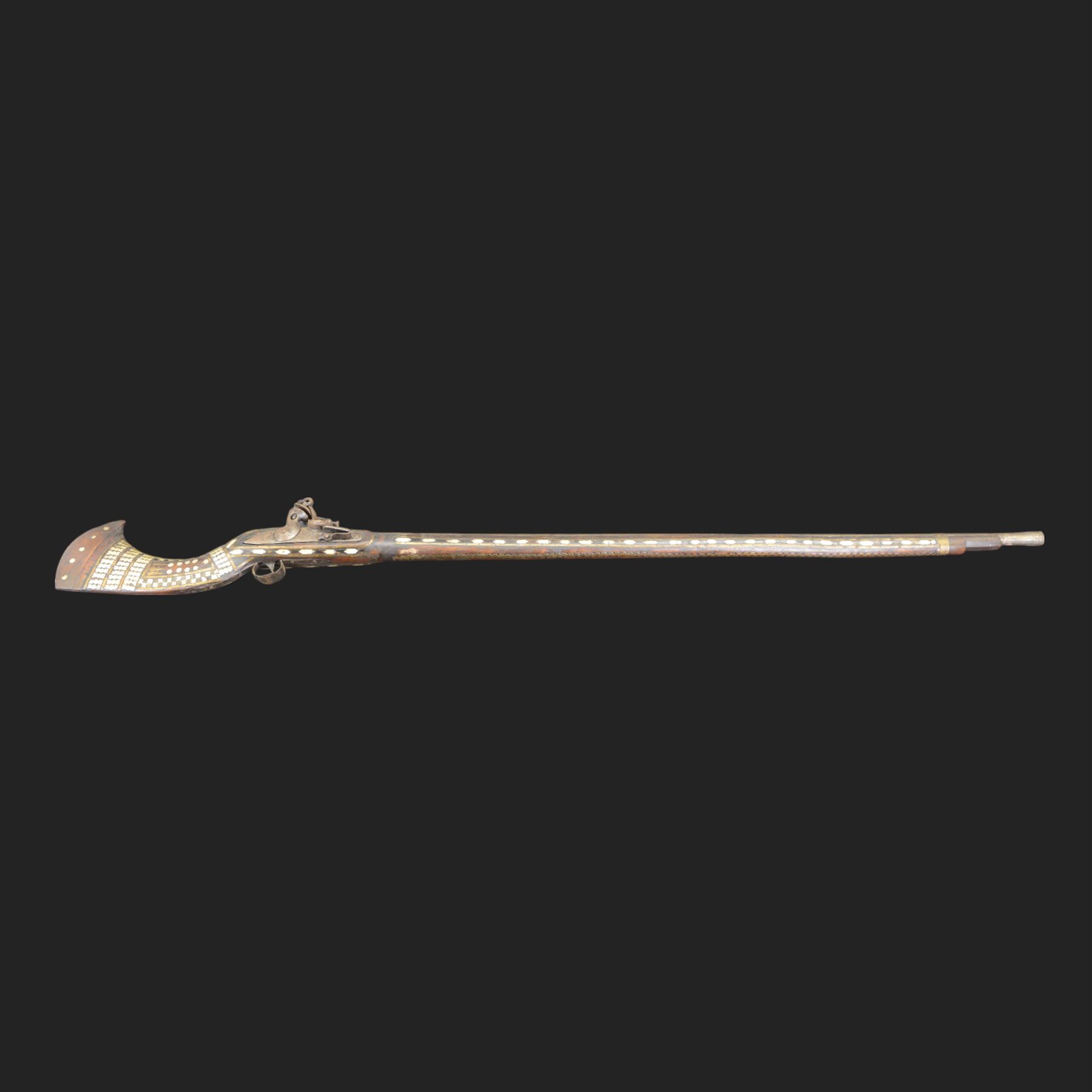 Indian Jezail style flintlock musket, with 118cm barrel, the East India Company lock marked 1818,  the curved butt inlaid with mother of pearl and brass decoration, overall L155cm